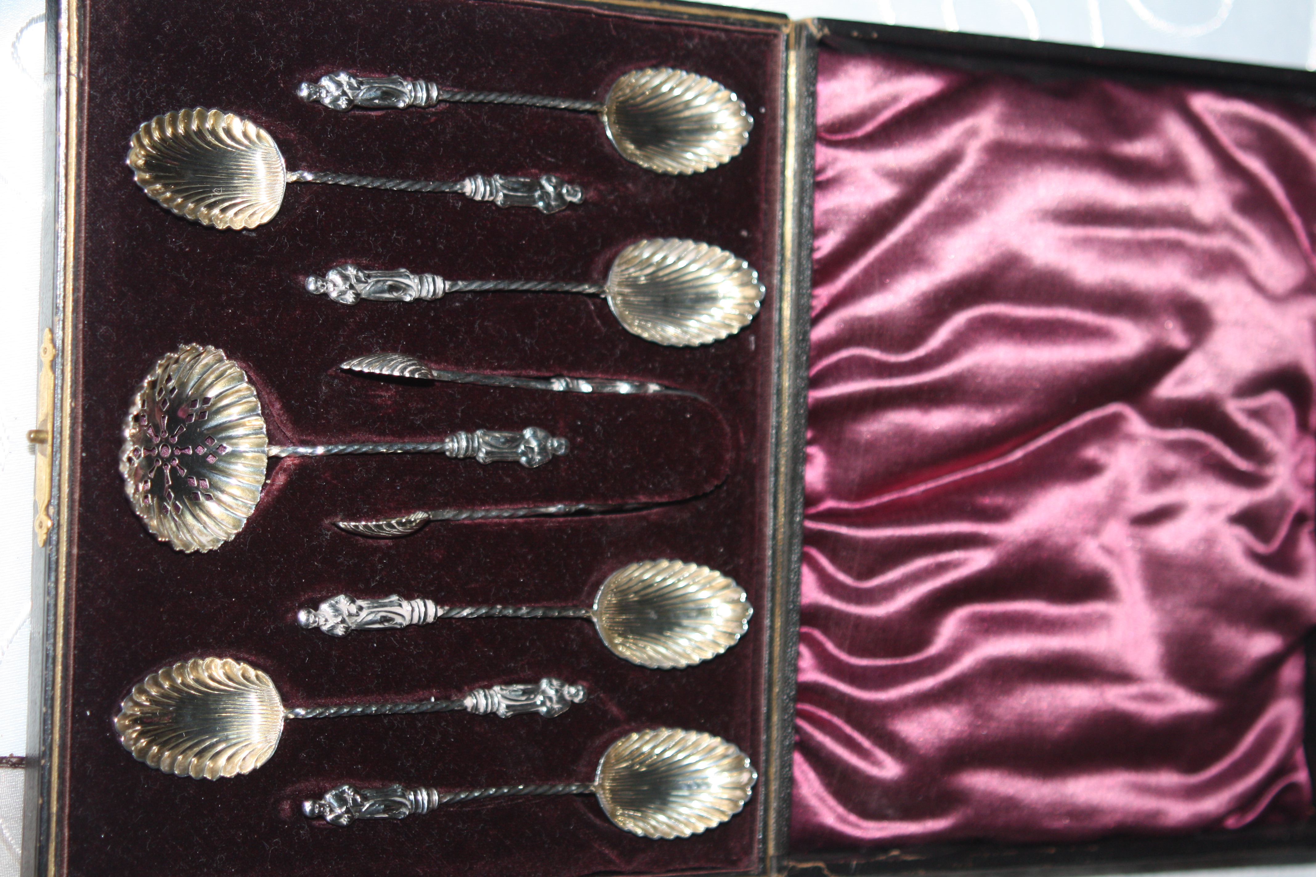 6 solid silver Apostle Spoons with cream spoon and candy tong