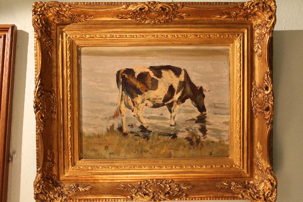 Impressionist early 20th century painting of a drinking cow