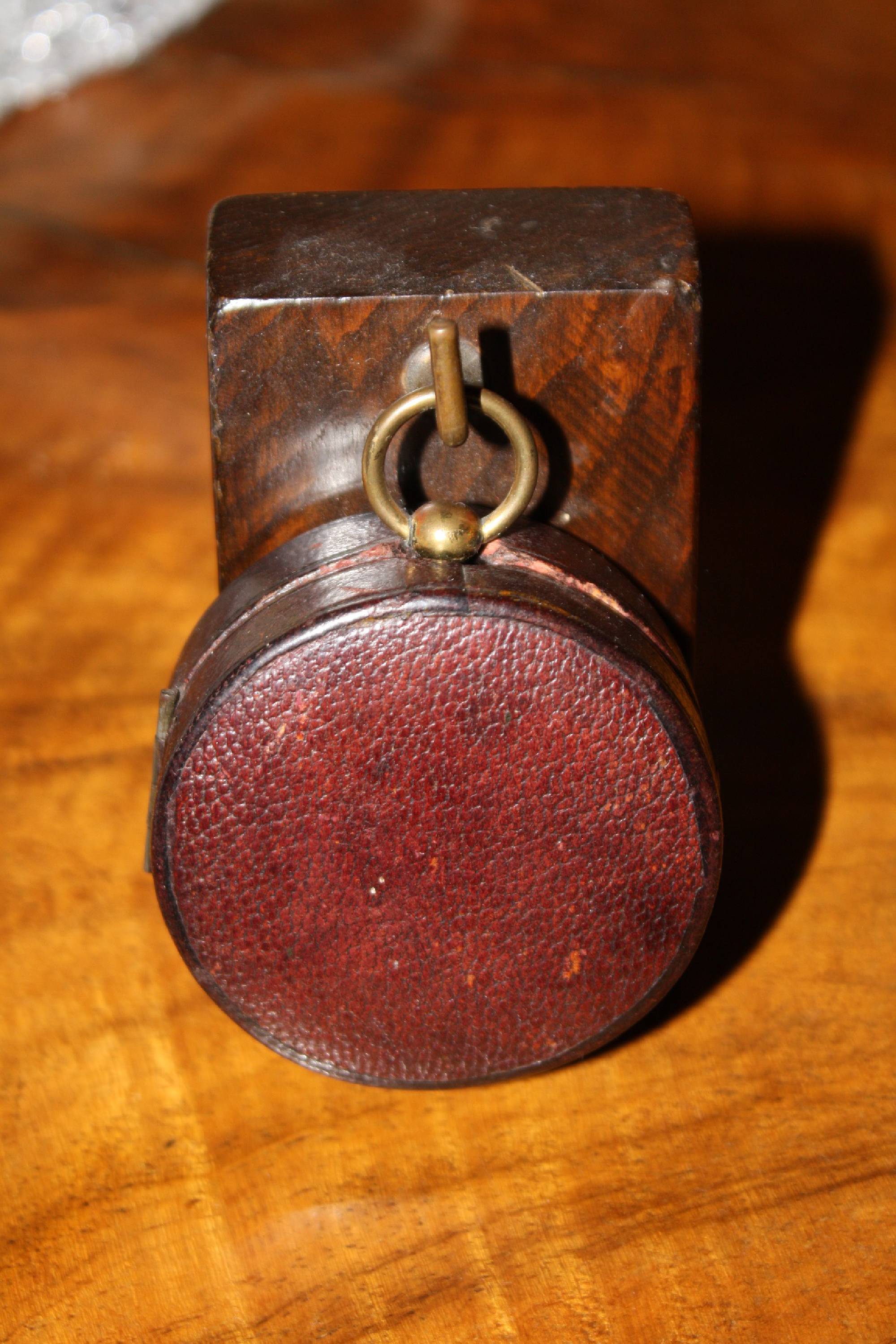 Small antique English travel-size brass barometer in a leather case, made by 'Negretti & Zambra', London