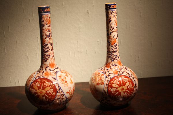 A pair of fine Japanese antique Imari brocade painted vases