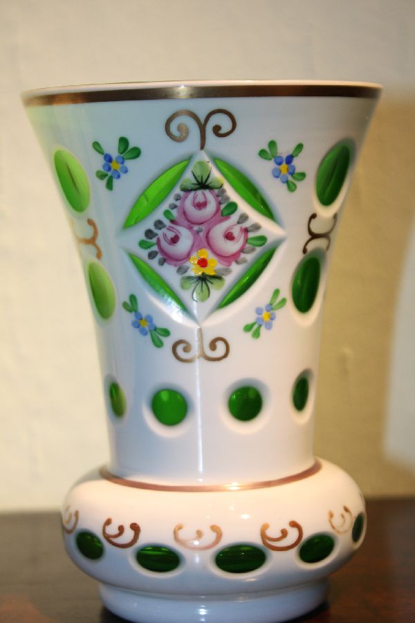 A vintage Bohemian 19th century green glass, white milk glass overlay vase